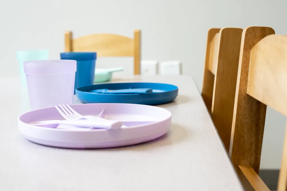 Child-size table set with plates and cups for feeding therapy