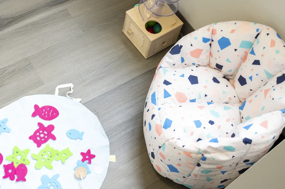 Sensory corner with a bean bag chair and tactile toys